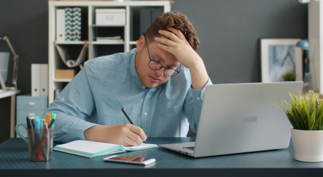 Frustrated worker doing manual data entry