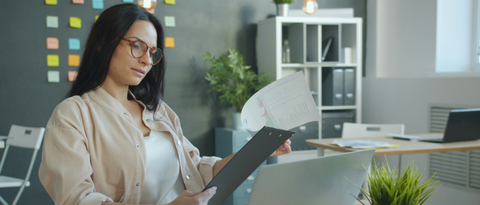 Employee reviewing operational documents